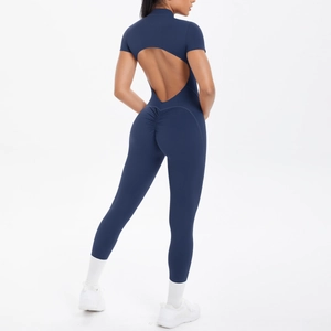 Detail of navy blue open-back yoga jumpsuit with scrunch butt lift and short sleeves