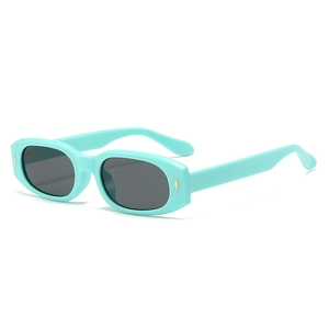 Vintage mint green square sunglasses with dark UV lenses and gold diamond accents