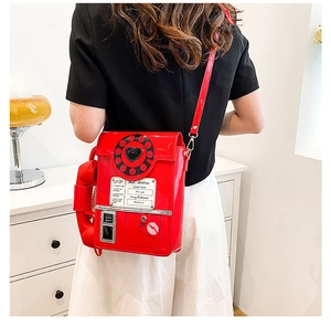 Detailed view of creative red vintage telephone crossbody bag with dial and handset