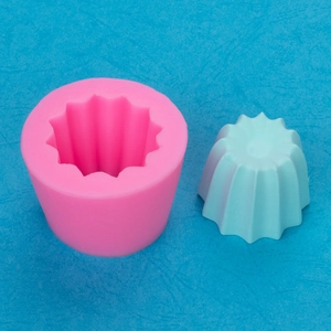 Pink silicone mold for DIY succulent pots and candles with ridged star-shaped finish