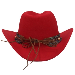 Detailed view of red felt cowboy hat with woven decorative band and leather chin strap