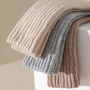 Thick wool blend crew socks in beige, grey, and brown with a classic ribbed texture