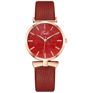 Women's quartz watch featuring leaf-patterned red dial and rose gold bow-shaped case