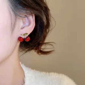 Elegant cherry earrings with red resin fruits and green leaves on silver needles