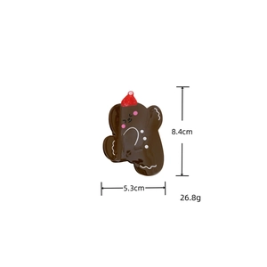 Gingerbread man hair claw clip in brown acetate with red hat and 8.4cm size detail