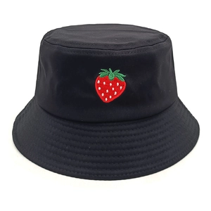 Close-up of strawberry embroidery detail and reinforced stitching on black bucket hat