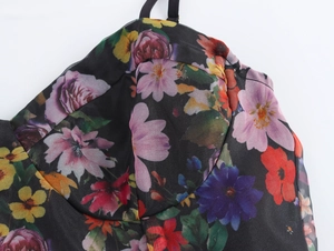 Detail of floral organza dress bodice with adjustable straps and multi-color print