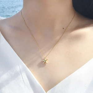 Elegant gold starfish pendant necklace for women on minimalist adjustable chain