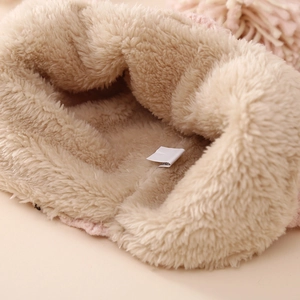 Pink winter knit baby hat with thick beige fleece lining for warmth and comfort