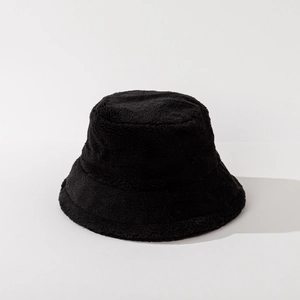 Detailed close-up showing the soft texture of the thick black faux fur winter bucket hat
