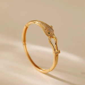 Luxurious 18K gold plated leopard head open bangle with sparkling pavé zircons and green eyes