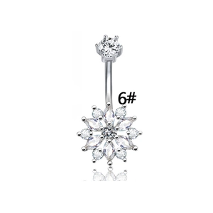 Detail of silver belly ring with flower-shaped cubic zirconia stones on white background