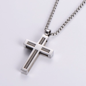 Polished stainless steel necklace featuring a unique spring-textured cross pendant design