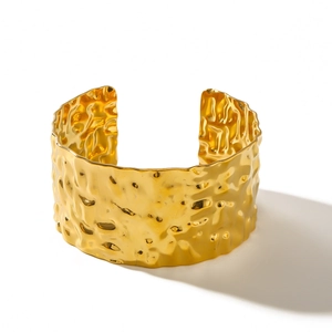 18K gold-plated stainless steel wide cuff bracelet with irregular hammered metal texture