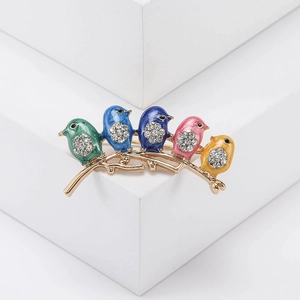 Detailed view of five colorful enamel birds brooch with rhinestones on golden branch