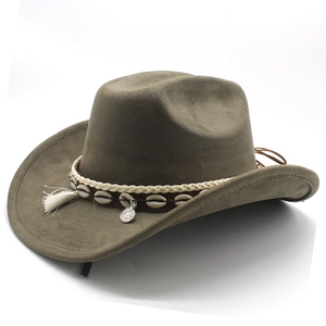Detail of olive green suede cowboy hat with white tassels and seashell decorations