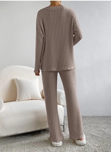 Detail of taupe knit two-piece set showing texture and drape of the ribbed fabric