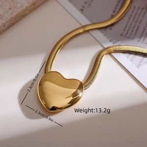 Detailed view of polished gold heart pendant with dimensions 2.3cm and 13.2g weight