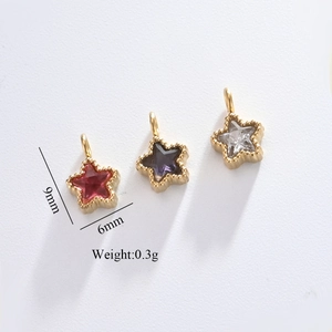 Macro detail of 9mm star-shaped zircon charms in gold stainless steel for DIY jewelry