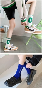 Detail view of cotton mid-tube socks with athletic C logo and Citymore 1985 text