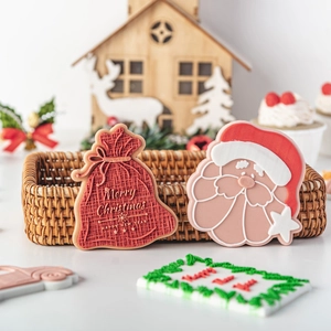 Christmas fondant cookie molds featuring Santa and red fortune bag designs for DIY baking
