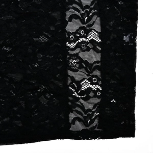 Close-up of black lace fabric with floral patterns on a sleeveless dress detail