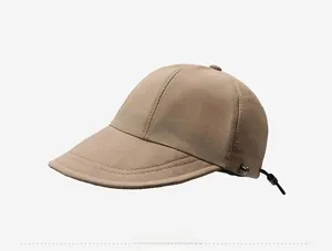 Side view of khaki outdoor sun hat featuring elongated brim and adjustable drawstring cord