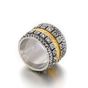Wide mixed-metal stainless steel ring with gold hammering and pavé set cubic zirconia