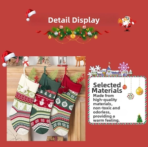Detail of knitted Christmas stockings set with snowflake patterns and pom-poms