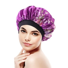 Detail of purple floral satin sleep cap with wide elastic band for hair protection