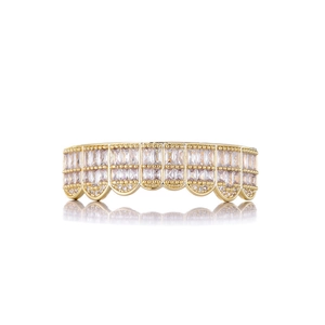 Detail of hip hop grillz with full pave cubic zirconia on a polished gold-plated metal base