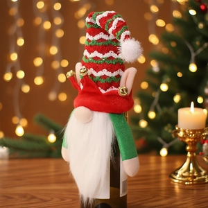 Christmas gnome wine bottle covers with striped hats and bells in cozy holiday setting