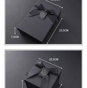 Detailed view of matte black kraft gift boxes with elegant ribbon bows and size tags