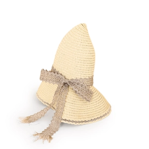 Detail of summer straw hat with wavy brim and lace ribbon bow on white background