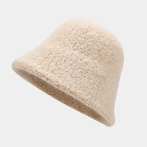 Close-up of beige wool blend bucket hat featuring soft sherpa texture for autumn warmth