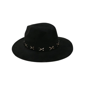 Close-up of black suede fedora featuring vintage metal cross buckle decorative band