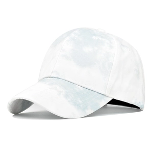 Detailed view of tie-dye pattern on 6-panel baseball cap with light blue and white swirls
