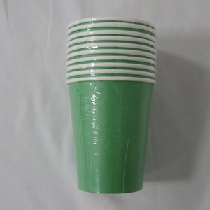 Detail of stacked green disposable paper cups wrapped in protective plastic film packaging
