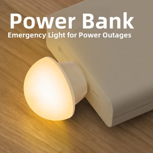 Close-up of mushroom-shaped USB night light with warm yellow glow on power bank