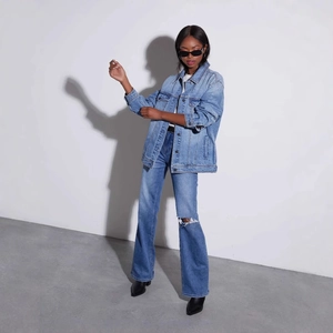 Vintage washed denim set with oversized jacket and distressed jeans in street style