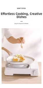 Non-stick frying pan with stone coating shown on a portable stove for cooking crepes