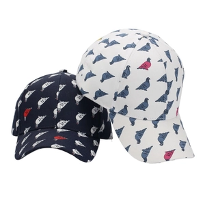 Navy blue and white baseball cap set featuring all-over pigeon print and curved brim