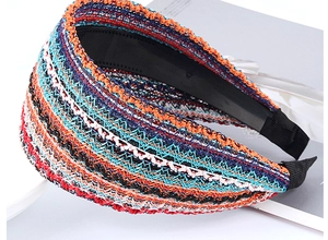 Detail of wide woven headband showing textured fabric and black non-slip inner teeth