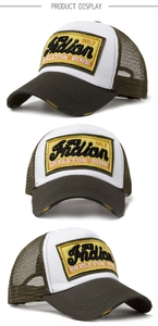 Close-up of vintage trucker hat with olive mesh and embroidered Indian NO.7 patch