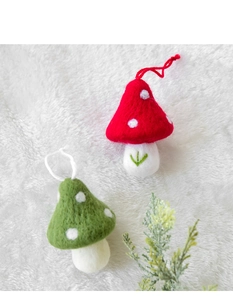 Detail of wool felt mushroom ornaments with textured finish and hanging loops