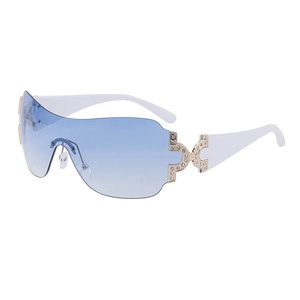Y2K style oversized wrap-around sunglasses with gradient blue lenses and rhinestone accents