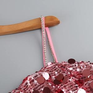 Detail of pink sequins and sparkling rhinestone strap on a sleeveless dress