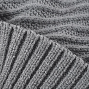 Close-up of grey jacquard knit beanie with soft ribbed texture and warm fleece lining