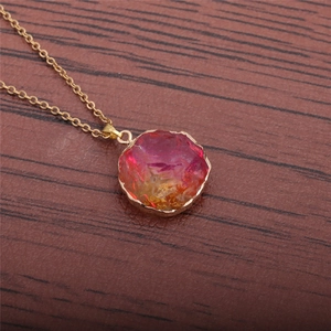 Minimalist gold necklace with irregular round purple and orange natural stone pendant