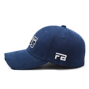Distressed dark blue baseball cap with 1983 embroidery and ripped brim detail